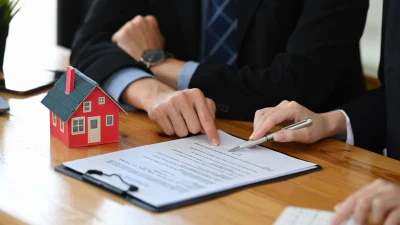 Cropped shot financial advisor consulting with client for real estate investment. Insurance and real estate concept.